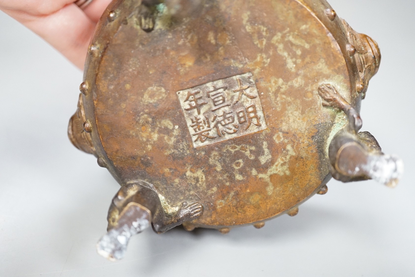 A Chinese bronze tripod censer, Xuande mark - 7cm tall